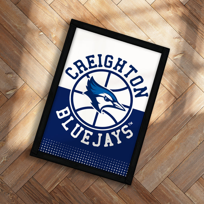 A framed poster with the logo of the Creighton Bluejays basketball team.
