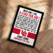 A framed poster with text, likely a fan quote or message, displayed on a wooden surface.