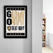 a framed poster with the text "GO ARMY BEAT NAVY" and a military insignia, hanging on a wall.