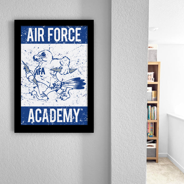 a framed poster of an Air Force Academy mascot, which is a bird-like creature with wings and a sword.