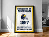 A framed poster on a wall celebrating the University of Michigan's 1997 College Football National Champions.