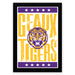 A framed poster featuring the text "GEAUX TIGERS" and a stylized tiger logo.