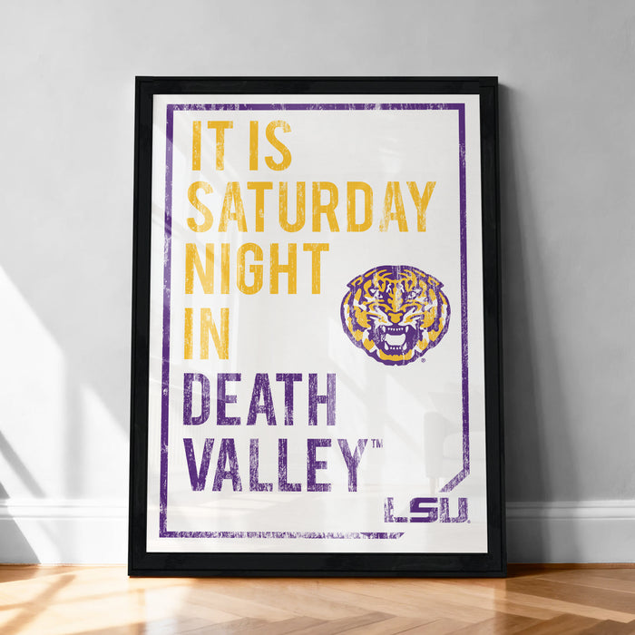 A framed poster with text and a tiger logo, promoting a Saturday night event at Death Valley.