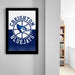 A framed poster of the Creighton Bluejays basketball team hangs on a wall, featuring the team's logo and name.