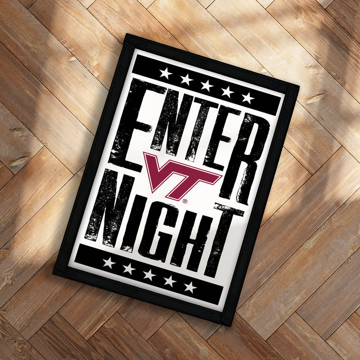 A framed poster with the text "ENTER NIGHT" and a Virginia Tech logo, placed on a wooden floor.