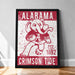 a framed poster with a red and white design depicting a cartoon elephant holding a football. The poster has the text "ALABAMA" and "CRIMSON TIDE" printed on it.
