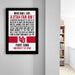 a framed poster with text on it, hanging on a wall next to a bookshelf.