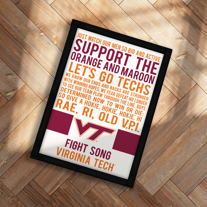 The image is a framed poster with text that reads "Just watch our men so big and active. Support the orange and maroon techs. Let's go techs. We know our ends and backs are stronger with winning our hopes and facing our fears. We see our team pour through the long odds. So determined now to win the long odds. RAE, R.I. OLD HOKIE. HI." The poster is placed on a wooden surface, and the text is in various colors, including orange, maroon, and white.