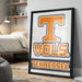 A framed poster with the word "TENNESSEE" and the logo of the Tennessee State University (TSU) is displayed on a wall in a bedroom.
