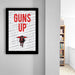 a framed poster with the text "GUNS UP" prominently displayed.