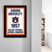 a framed poster with the text "Auburn University 1957 College Football National Champions" on it, hanging on a wall.