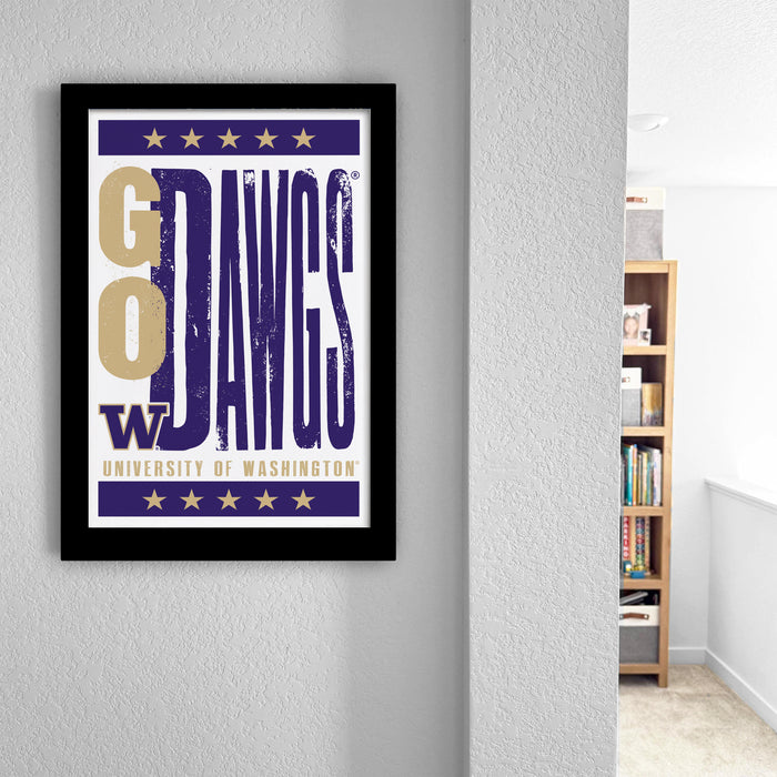 a framed poster with the text "GO DAWG" and "UNIVERSITY OF WASHINGTON" printed on it, hanging on a wall.
