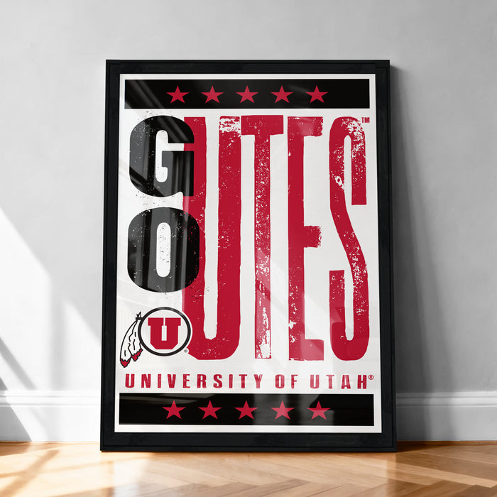 A framed poster with the text "GOUTES UNIVERSITY OF UTAH" prominently displayed.