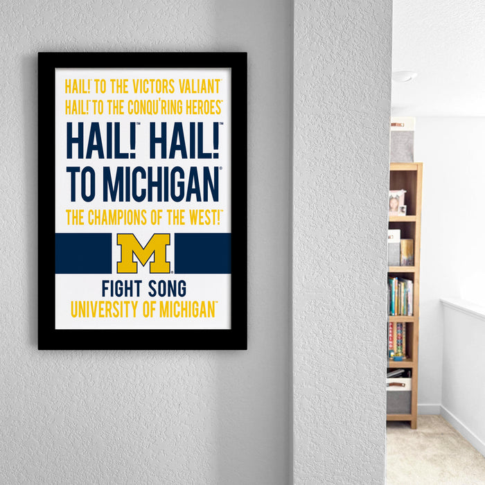 a framed poster with text that reads "Hail! Hail! To Michigan! The champions of the West! Fight Song University of Michigan".