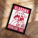 A framed poster featuring the Alabama Crimson Tide football team logo and text.