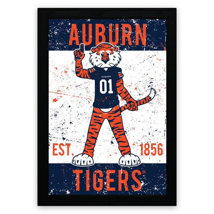 a framed poster with a tiger mascot wearing a football jersey and the text "AUBURN TIGERS" prominently displayed.