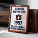 A framed sign displaying the Auburn University logo and text, indicating the university's achievement in college football in 1957 as the National Champions.