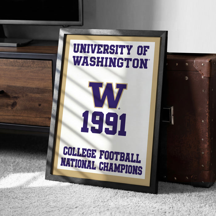 A framed poster celebrating the University of Washington's College Football National Champions from 1991, placed on a carpeted floor next to a wooden chest.