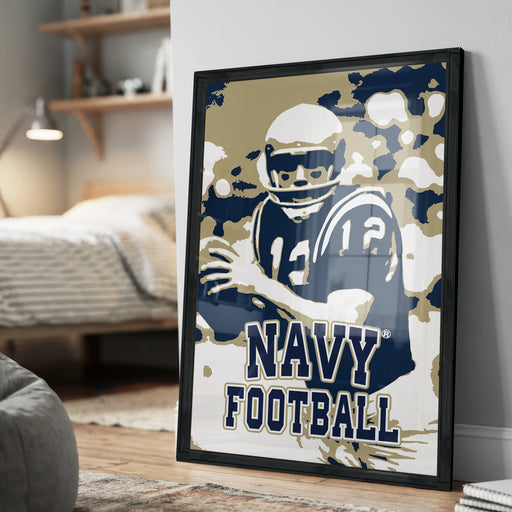A framed poster featuring a football player in a navy uniform, with the text "NAVY FOOTBALL" prominently displayed.