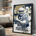 A framed poster featuring a football player in a navy uniform, with the text "NAVY FOOTBALL" prominently displayed.