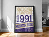A framed poster on a wall celebrating the 1991 Washington Huskies' national championship victory.