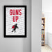a framed poster with the text "GUNS UP" displayed prominently.