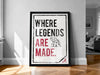 A framed poster with the text "WHERE LEGENDS ARE MADE" and an illustration of an elephant.