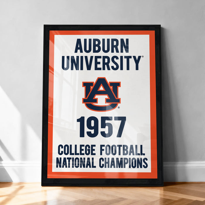 The image is a framed poster celebrating Auburn University's 1957 College Football National Champions, featuring the Auburn University logo and text.