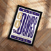 A framed poster with the text "GO DAWKINS" and "UNIVERSITY OF WASHINGTON" printed on it, placed on a wooden floor.