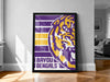 A framed poster of a tiger's head with the text "BAYOU BENGALS" on it, displayed on a wall in a room.