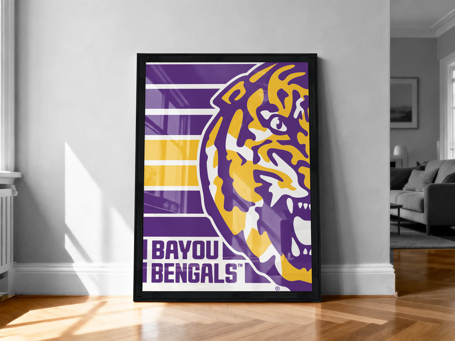 A framed poster of a tiger's head with the text "BAYOU BENGALS" on it, displayed on a wall in a room.