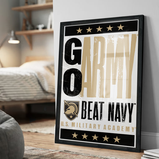 A framed poster with the text "GARMY BEAT NAVY" and a U.S. Military Academy logo, displayed on a wall in a bedroom setting.