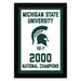A framed poster celebrating the Michigan State University (MSU) National Champions, featuring the university's logo and the text "Michigan State University" and "2000 National Champions".