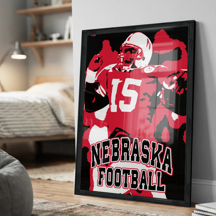 A framed poster of a football player in a Nebraska uniform, with the text "NEBRASKA FOOTBALL" prominently displayed.