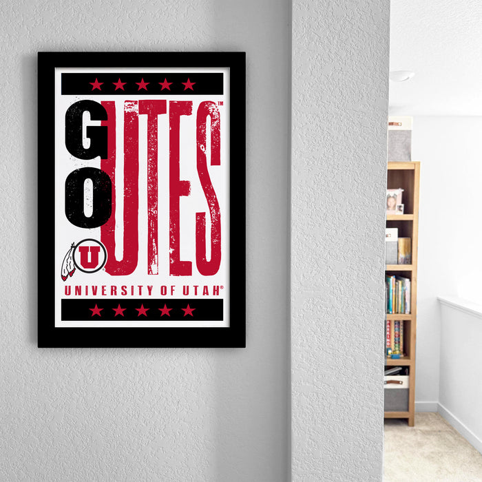 a framed poster with the text "GO UTES UNIVERSITY OF UTAH" displayed prominently on it.
